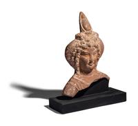 An Egyptian Terracotta Head of Harpocrates