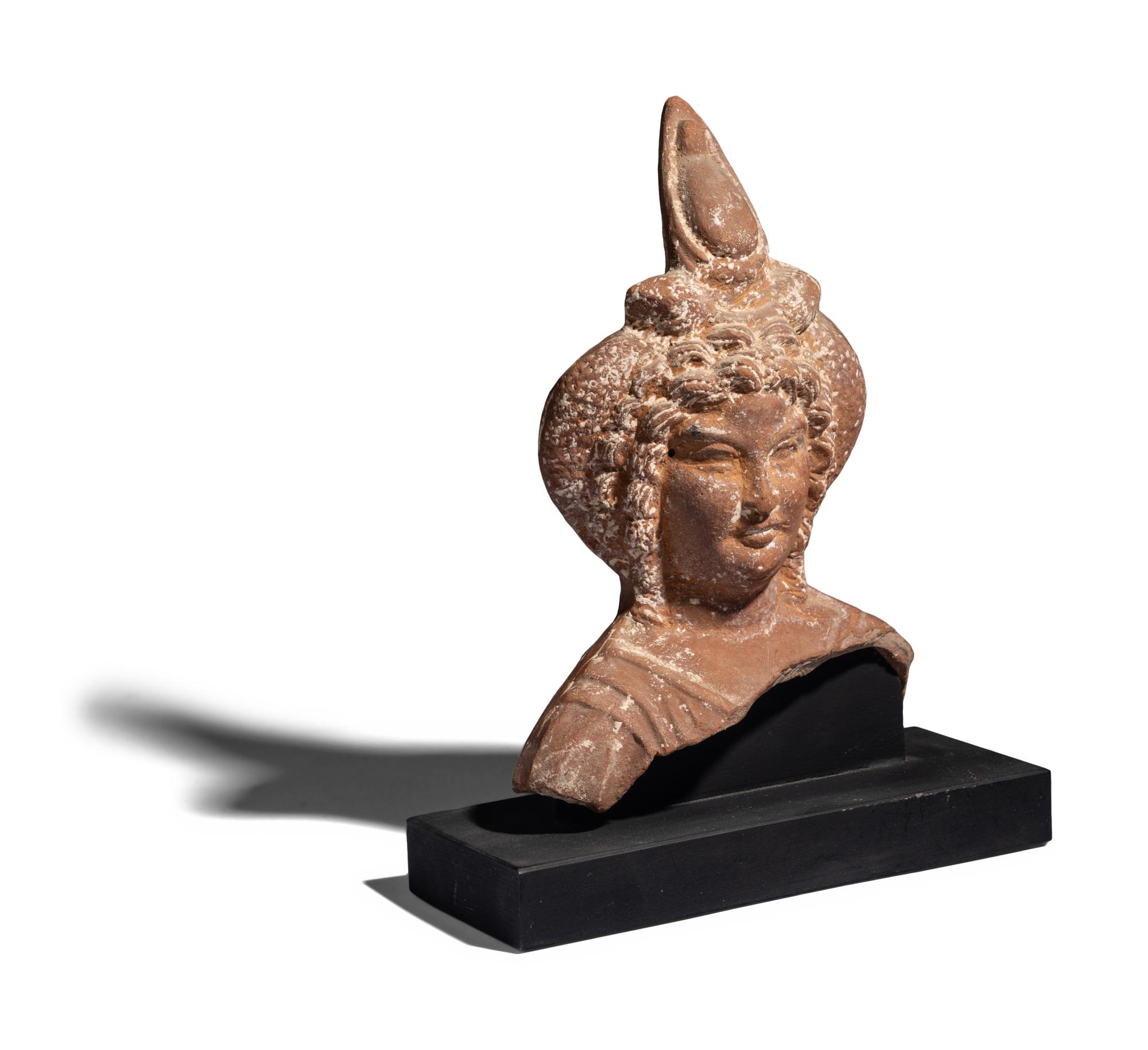 An Egyptian Terracotta Head of Harpocrates