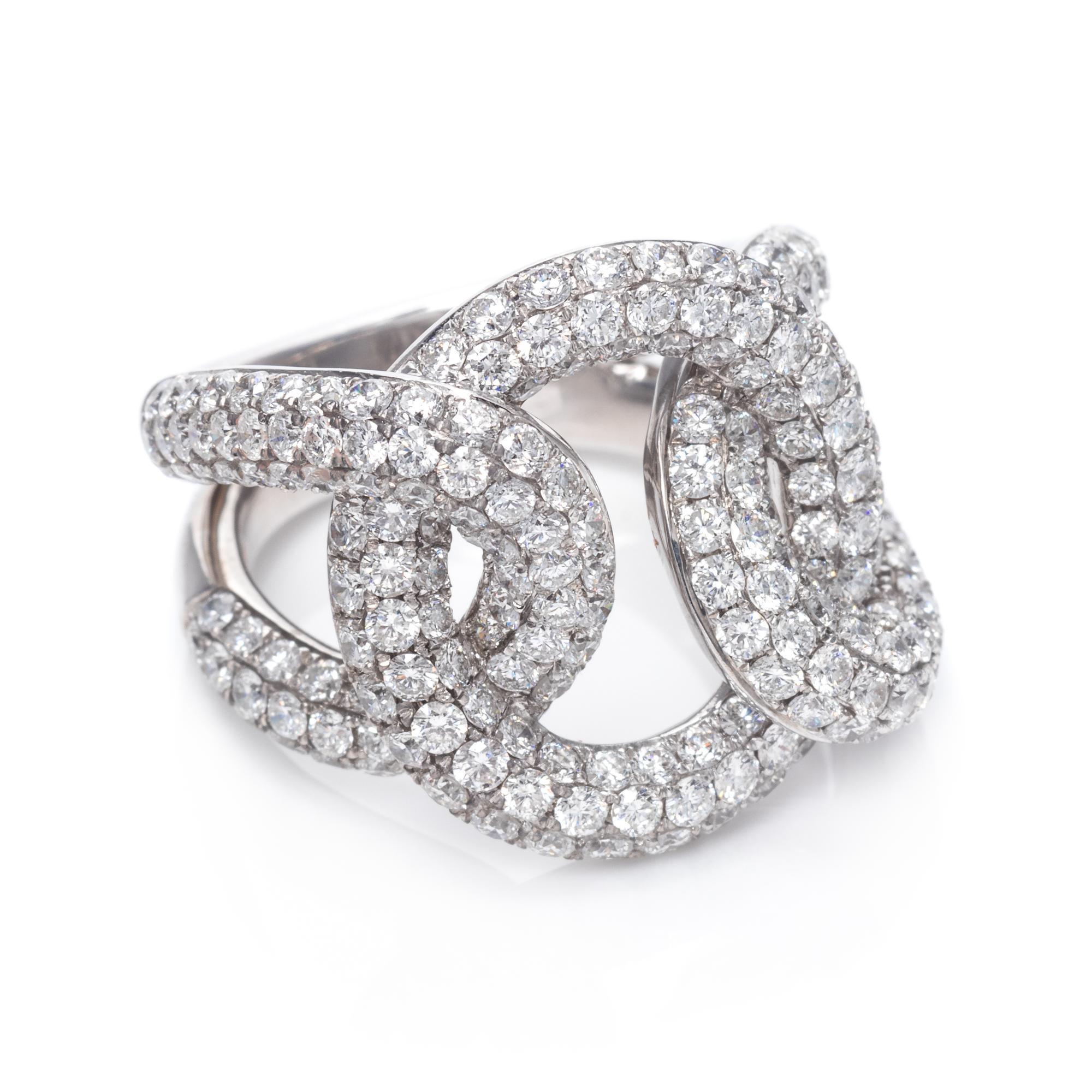 An 18 Karat White Gold and Diamond Knot Motif Ring,