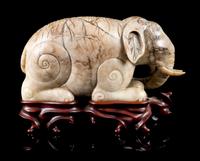 A Mottled Jade Figure of an Elephant Length 7 inches.