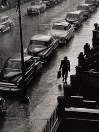 Ruth Orkin (1921-1985) Man in Rain, West 88th Street, New York City, 1952