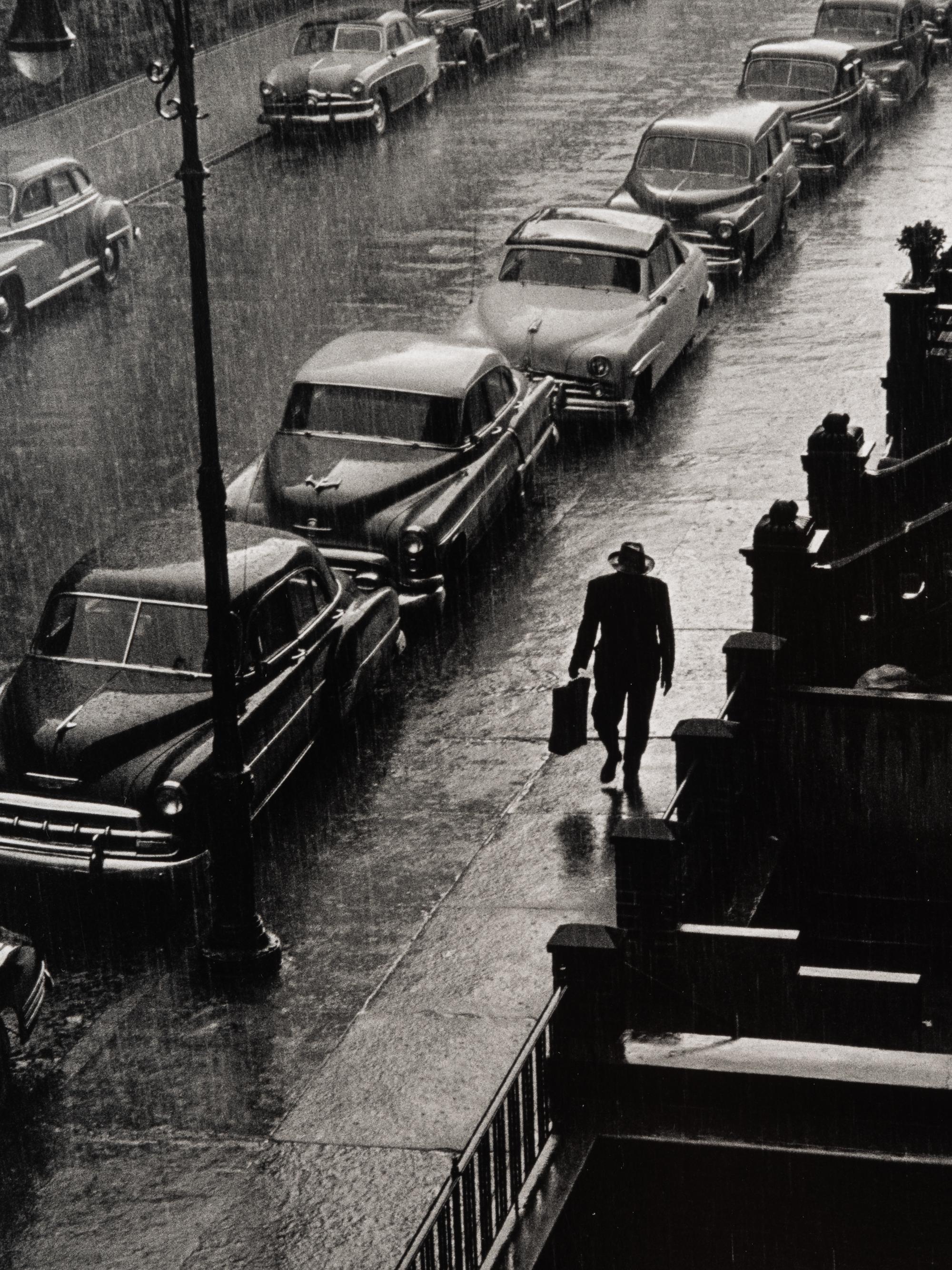 Ruth Orkin (1921-1985) Man in Rain, West 88th Street, New York City, 1952