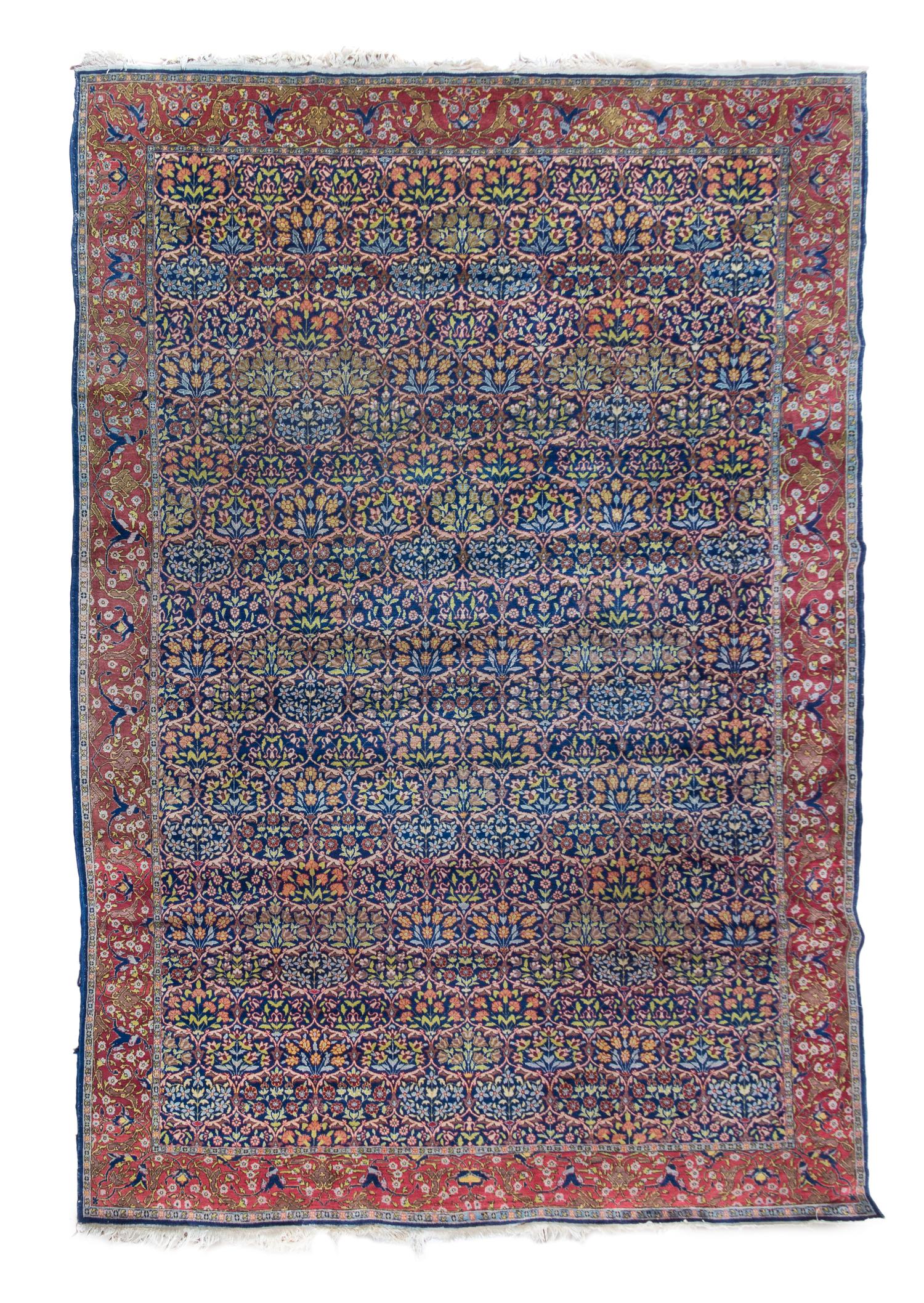 A Hereke Wool Rug 11 feet 2 inches x 7 feet 7 inches.