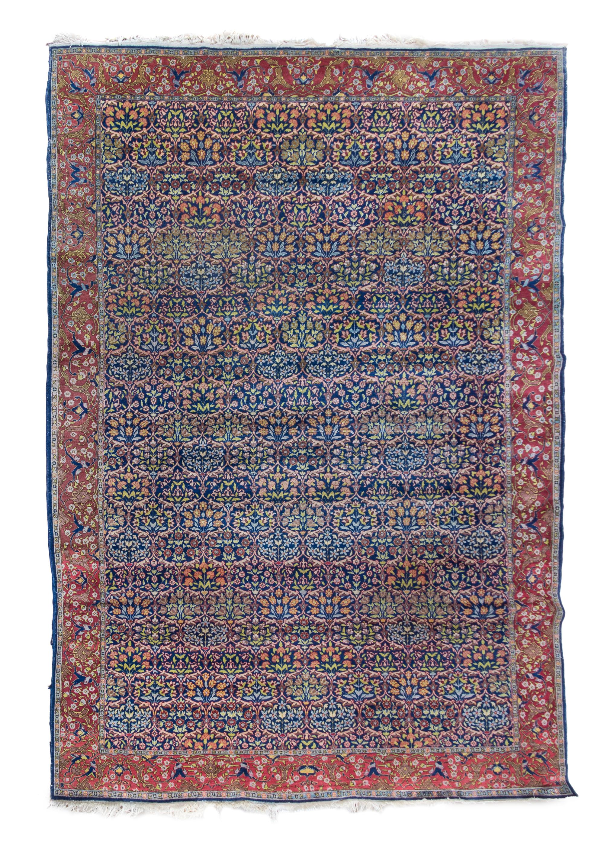 A Hereke Wool Rug 11 feet 2 inches x 7 feet 7 inches.