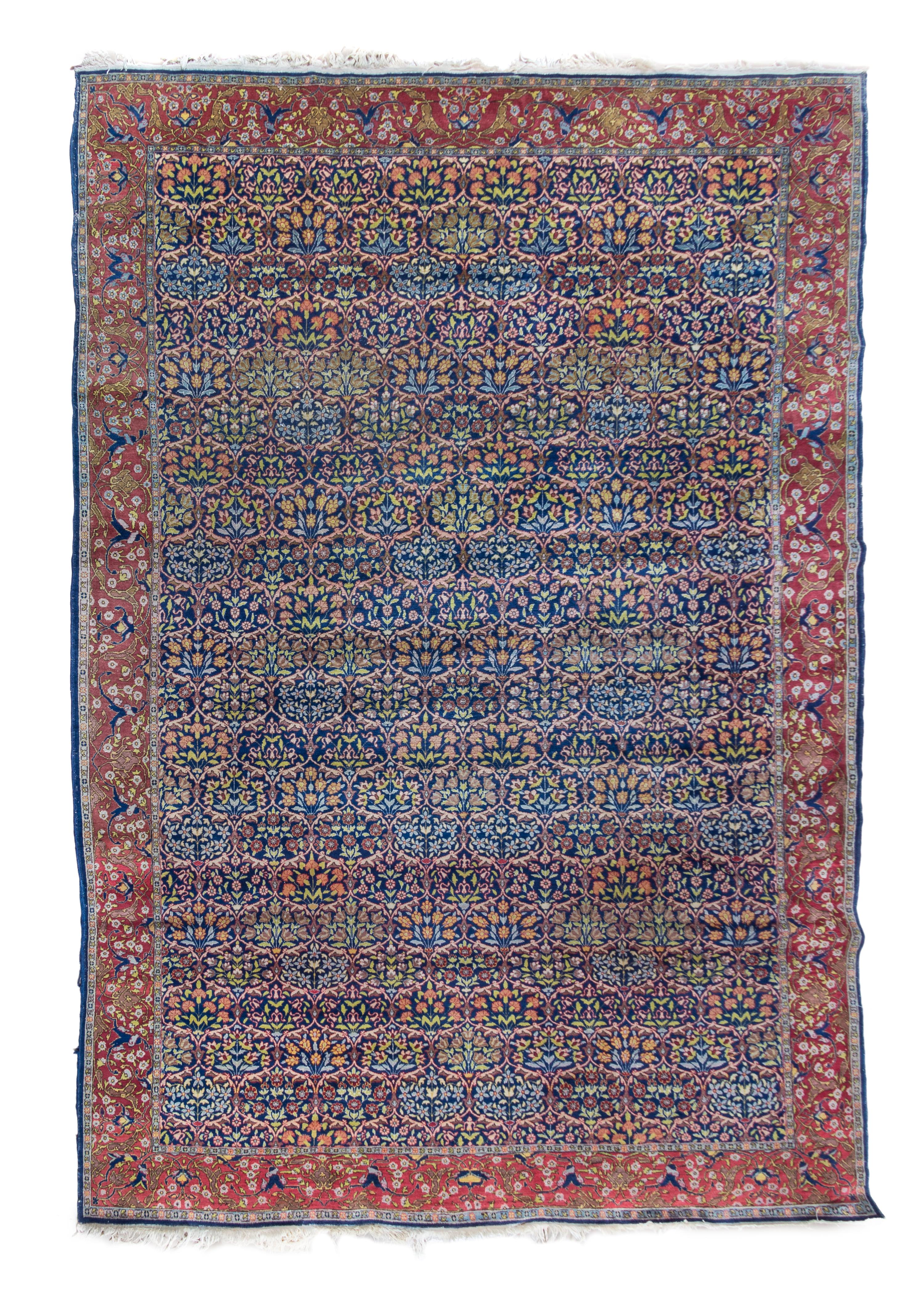 A Hereke Wool Rug 11 feet 2 inches x 7 feet 7 inches.