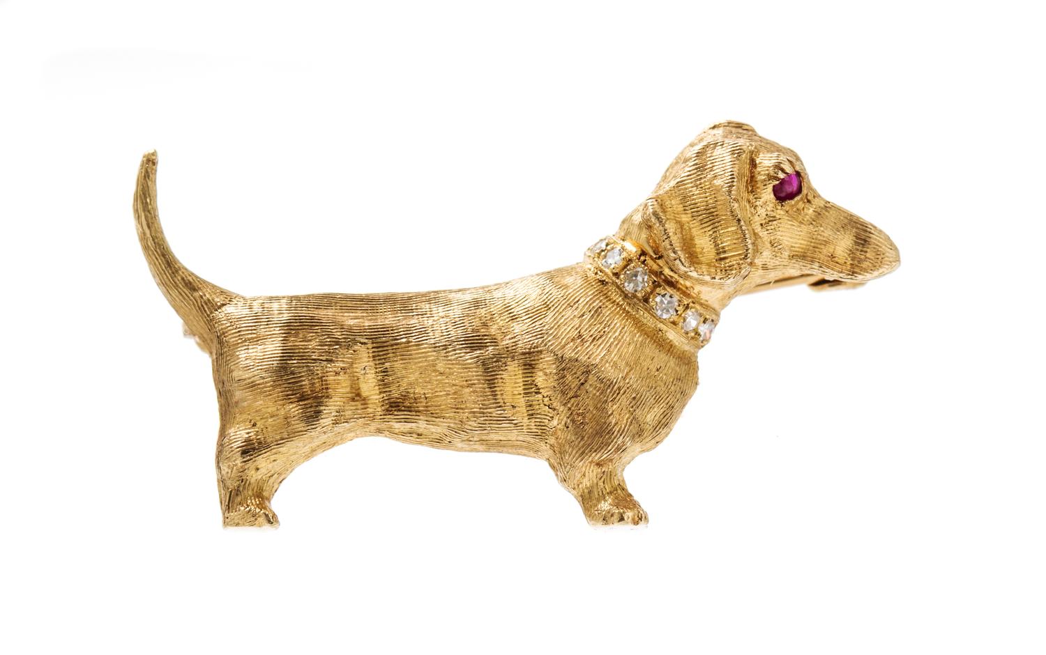 A 14 Karat Yellow Gold, Diamond and Ruby Dachshund Pin, 3.00 dwts.