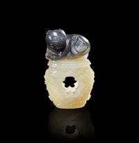 A Chinese carved two-color jade "Cat and Butterfly on Garden Stool" toggle “貓蝶”俏色玉雕一件