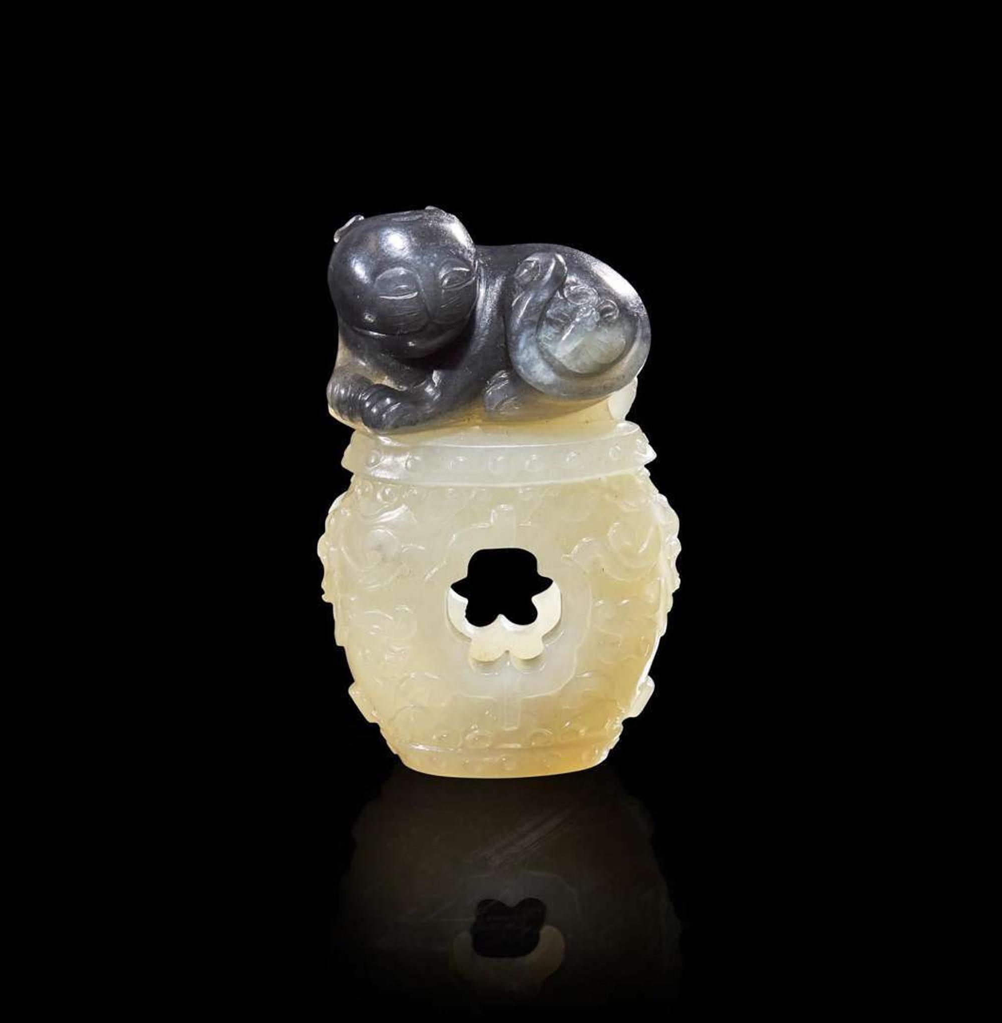 A Chinese carved two-color jade "Cat and Butterfly on Garden Stool" toggle “貓蝶”俏色玉雕一件