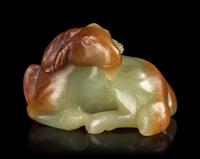 A Russet and White Jade Figure of a Ram