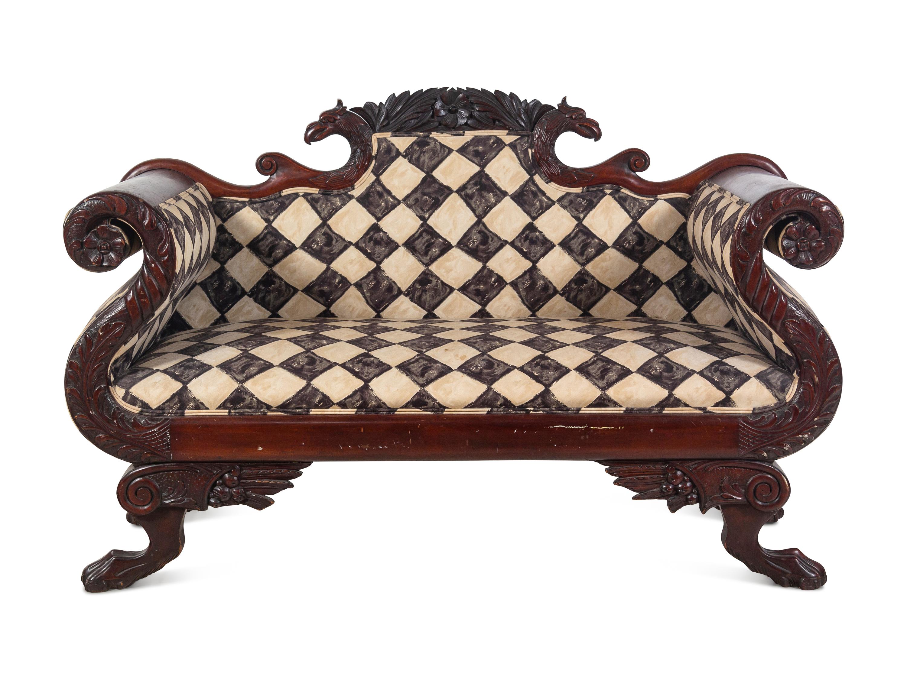 A Classical Carved and Figured Mahogany Settee