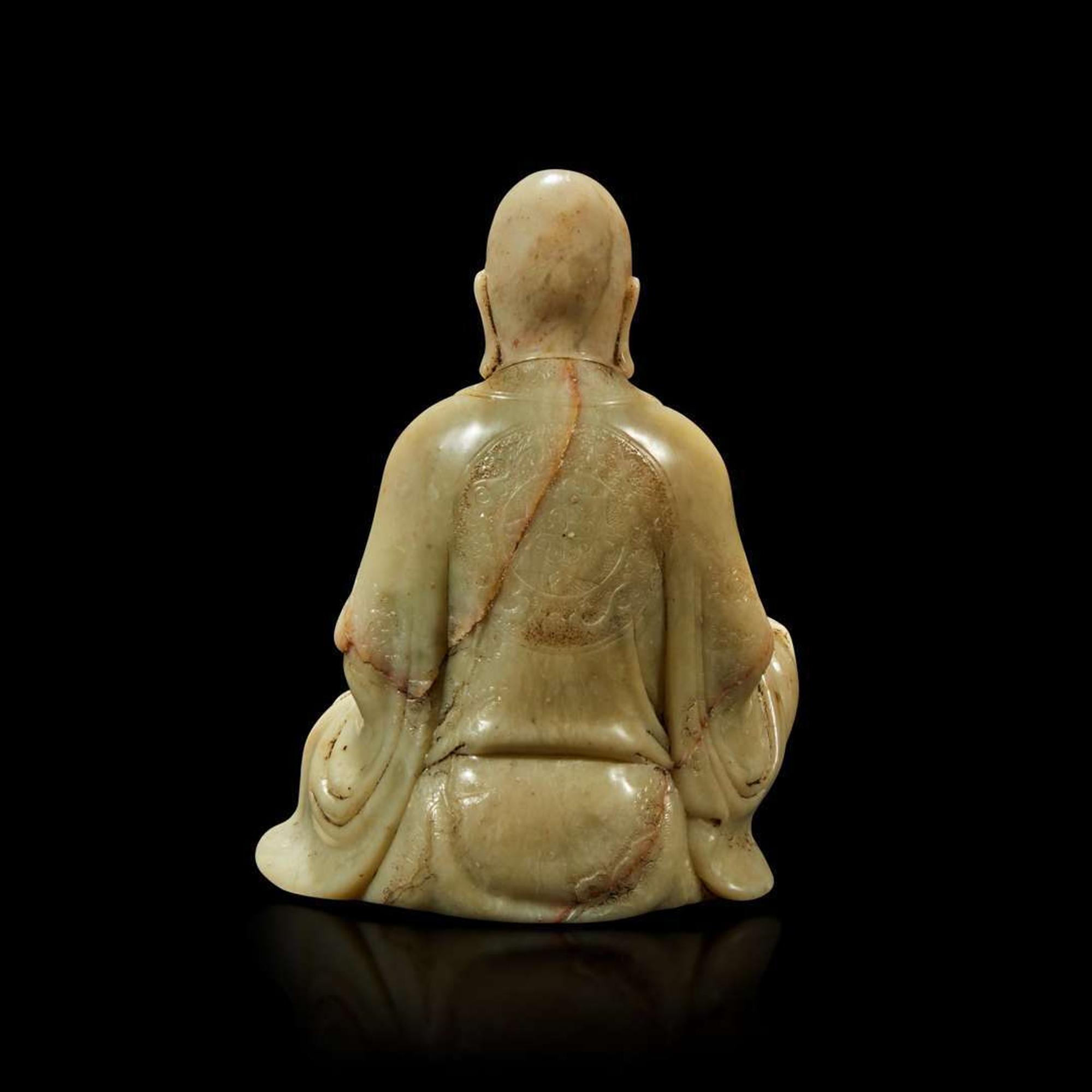 A finely-carved Chinese soapstone figure of a seated luohan
