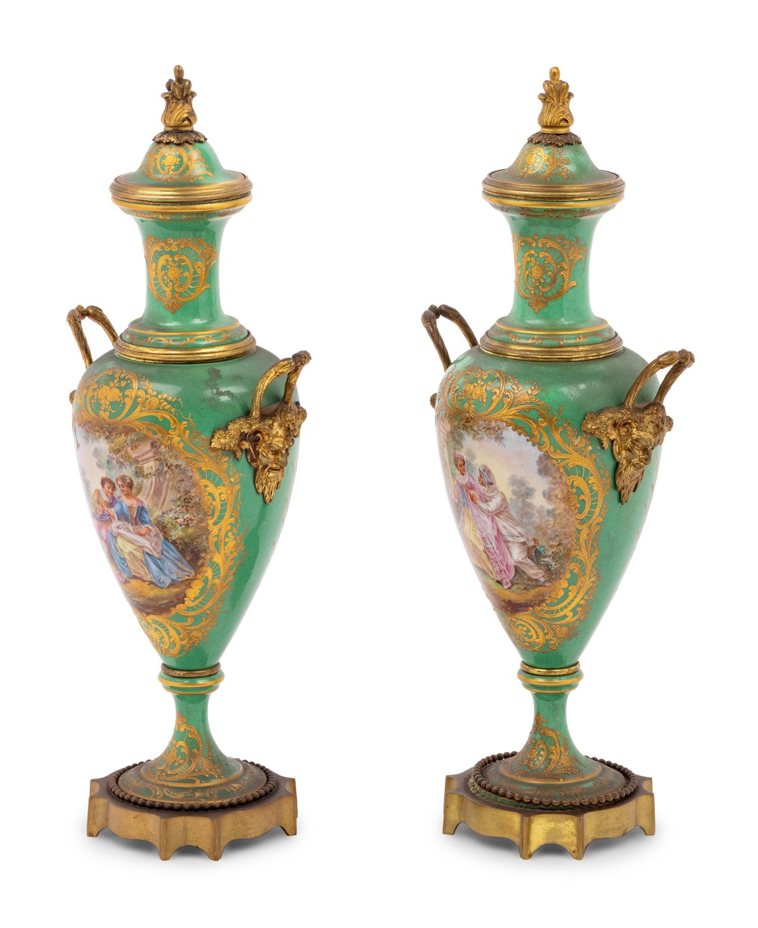 A Pair of Sèvres Style Gilt Metal Mounted Porcelain Urns