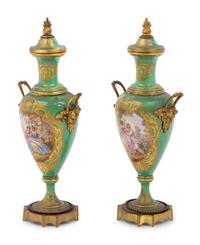 A Pair of Sèvres Style Gilt Metal Mounted Porcelain Urns