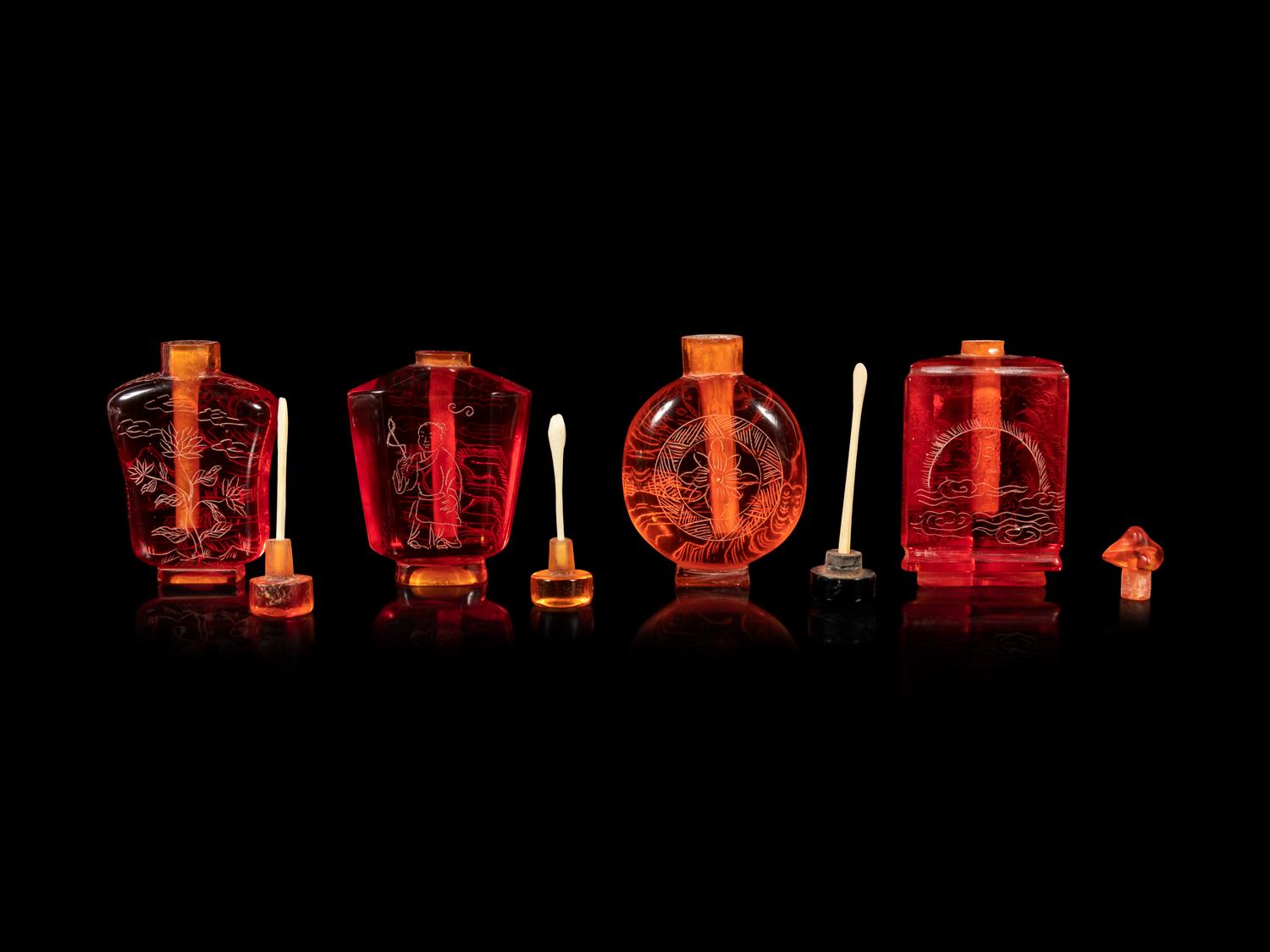 Four Chinese Amber Tone Glass Snuff Bottles