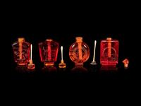 Four Chinese Amber Tone Glass Snuff Bottles
