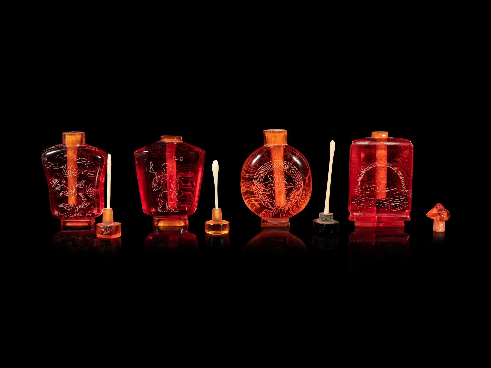 Four Chinese Amber Tone Glass Snuff Bottles