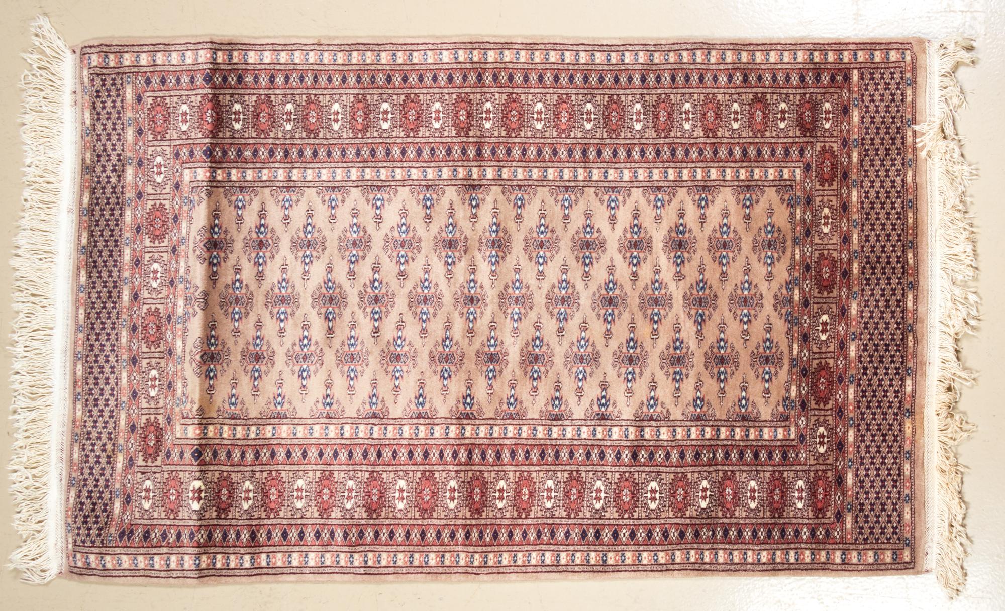 A Bokhara Wool Rug 5 feet 3/4 inches x 3 feet 2 inches.