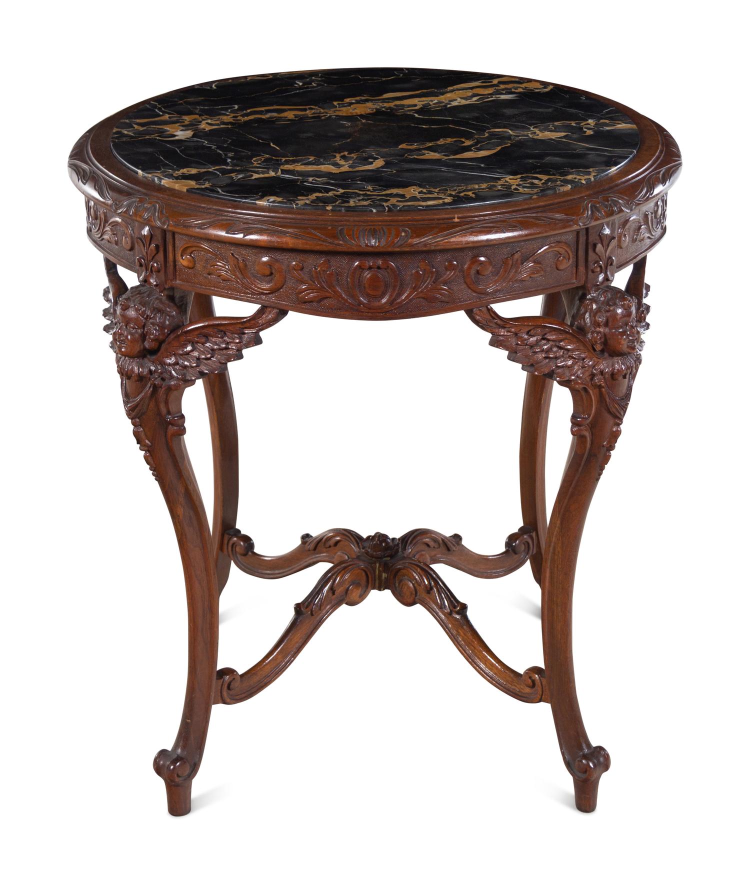An Italian Carved Walnut Marble-Top Center Table