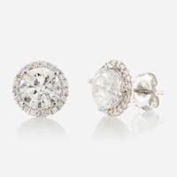 A pair of diamond and gold earrings
