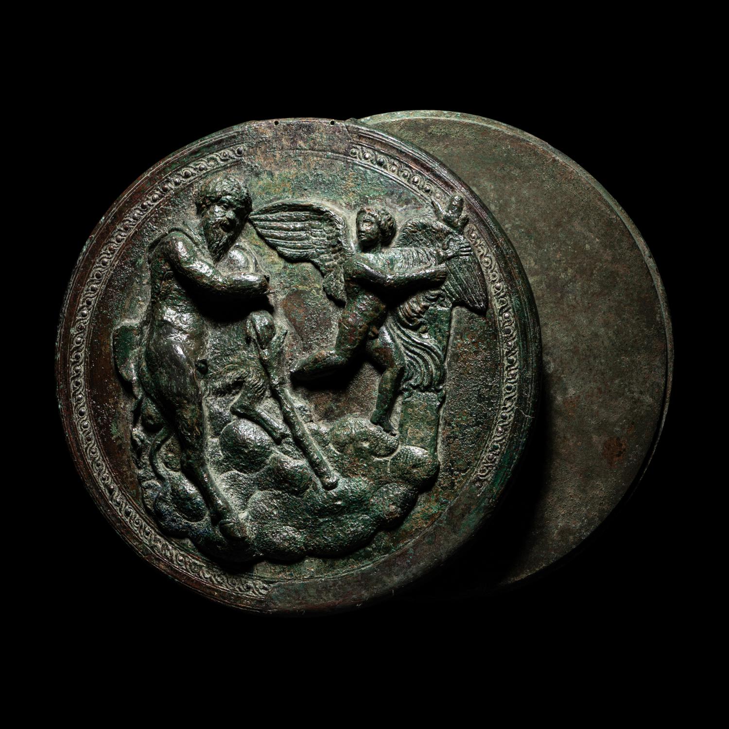 A Greek Bronze Box Mirror with Pan and Eros