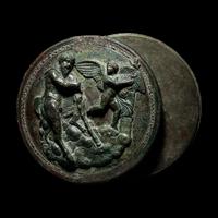 A Greek Bronze Box Mirror with Pan and Eros