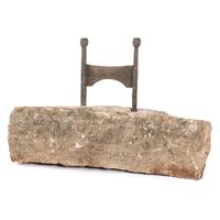 A Wrought Iron Boot Scrape with Limestone Base
