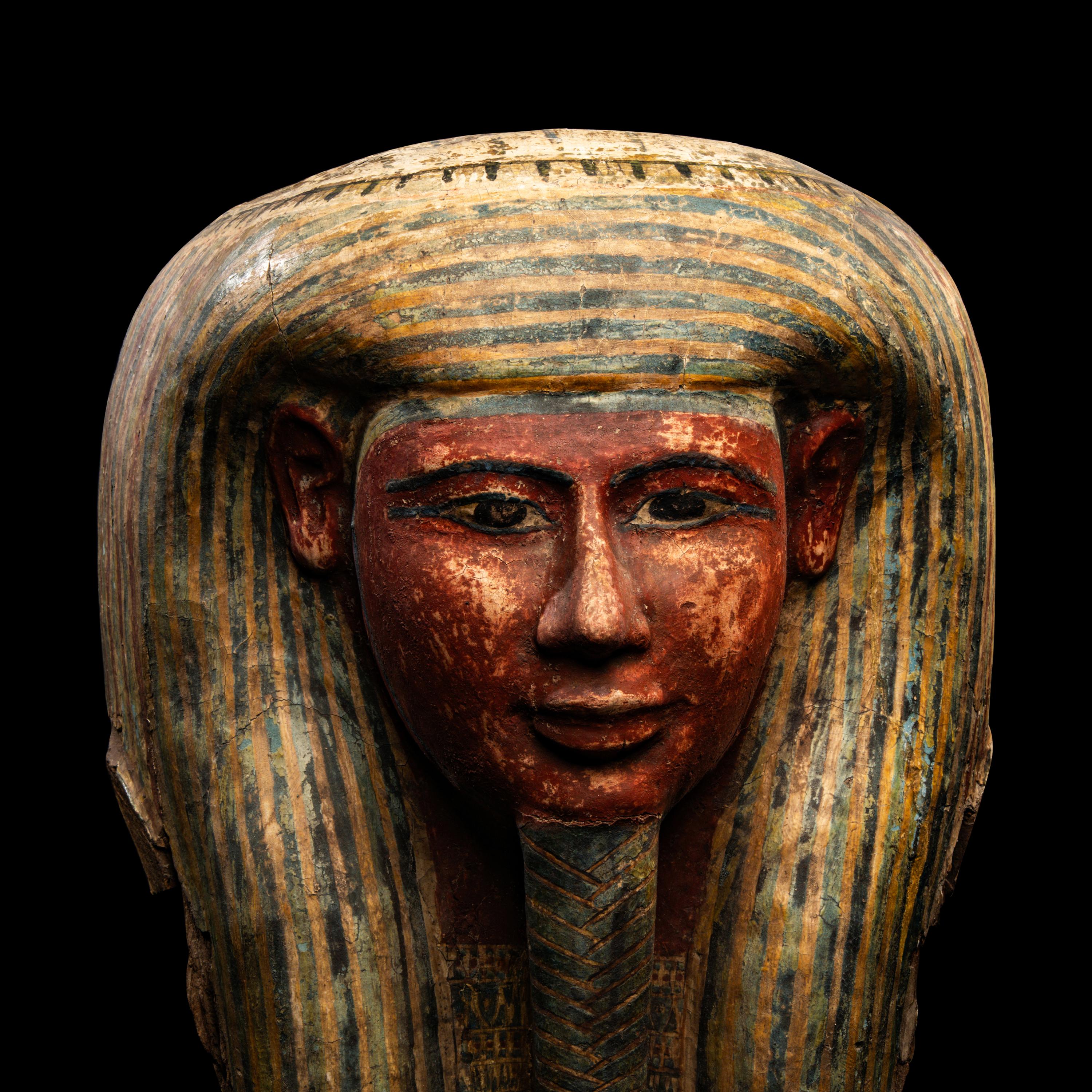 An Egyptian Polychrome Wood Mummy Mask