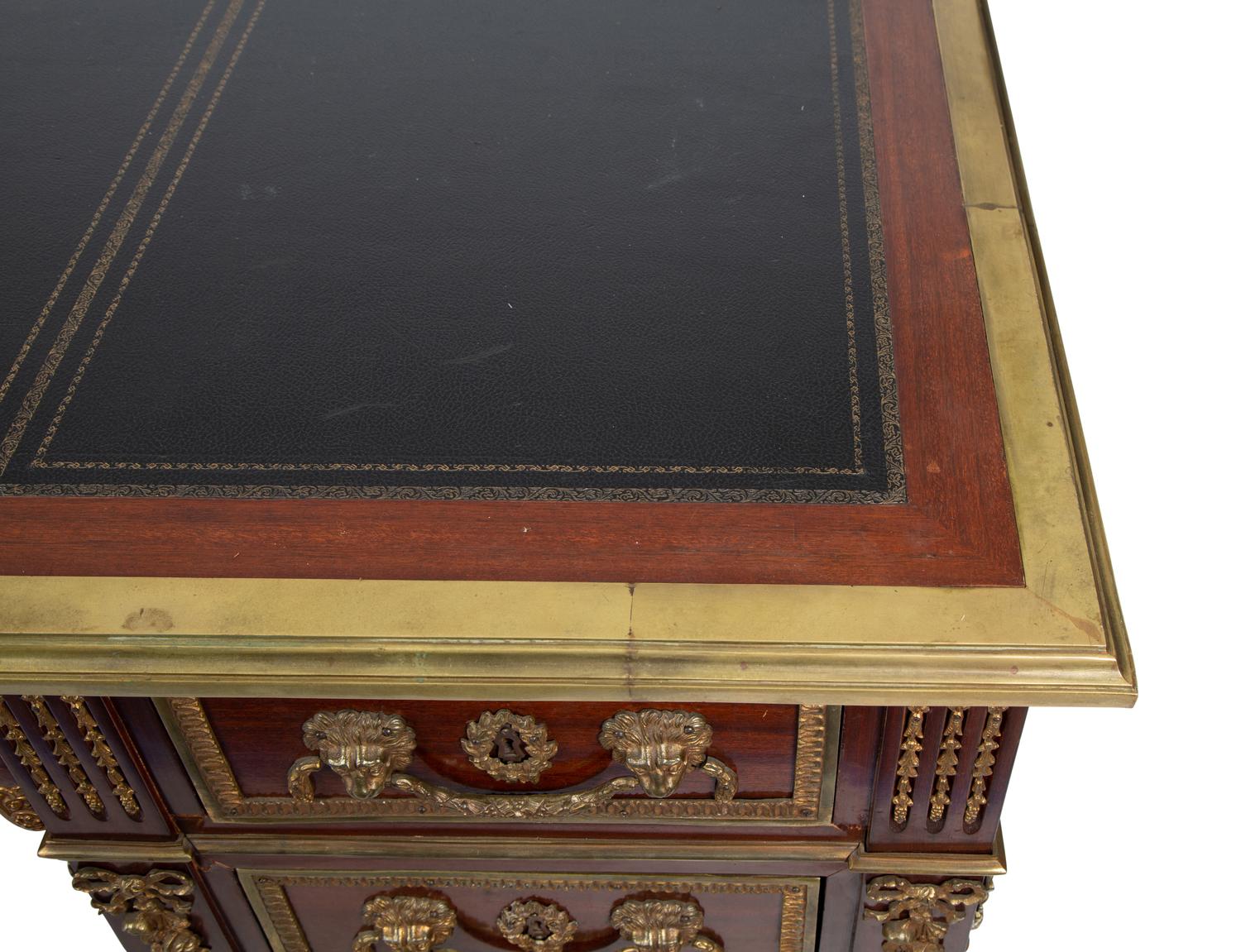 A Louis XVI Style Gilt Bronze Mounted Mahogany Desk — EARLY 20TH CENTURY