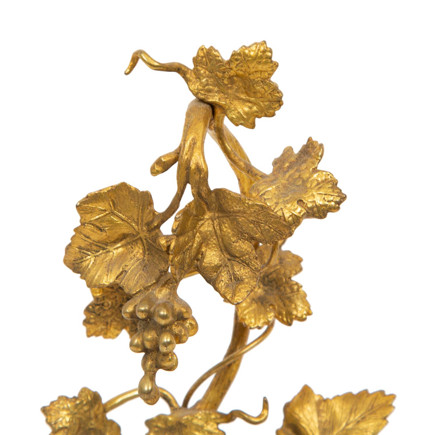 A Carved Rock Crystal Figure of Guanyin on a Grapevine Decorated Gilt Bronze Stand