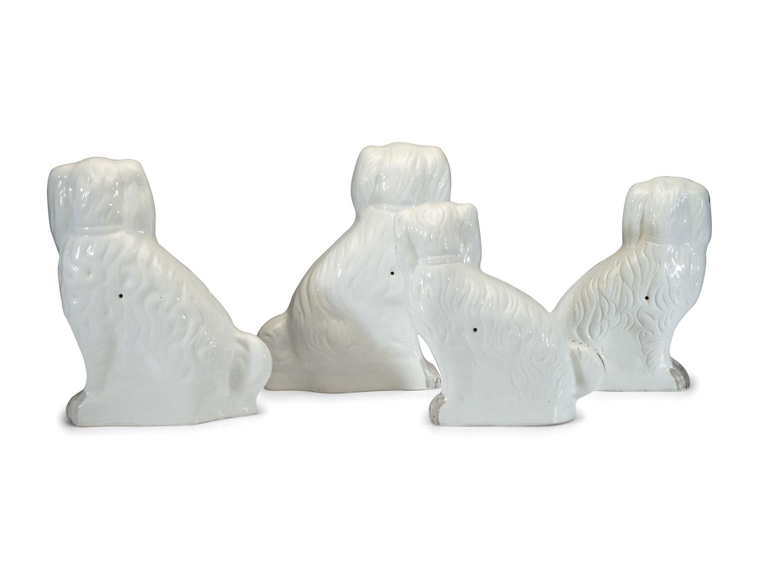 Four Staffordshire Spaniel Figures