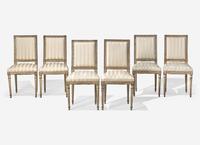 A Set of Six Louis XVI Cream-Painted and Parcel Gilt Dining Chairs
