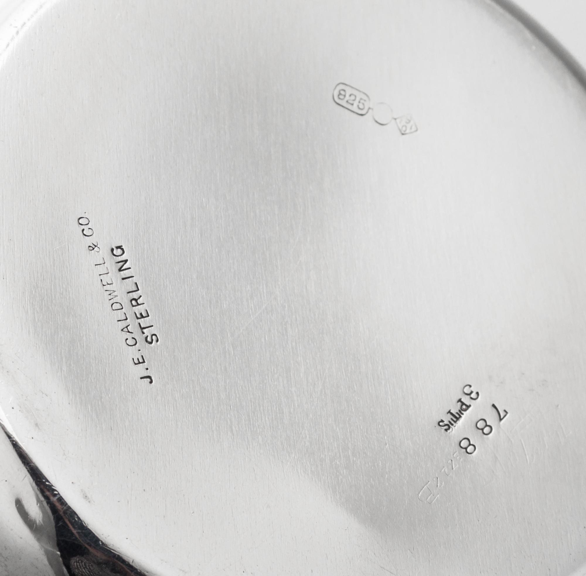 An American Silver Tyg, Dominick & Haff, New York, NY, 1901, Retailed by J.E. Caldwell, Philadelphia, PA, having foliate capped twin ha