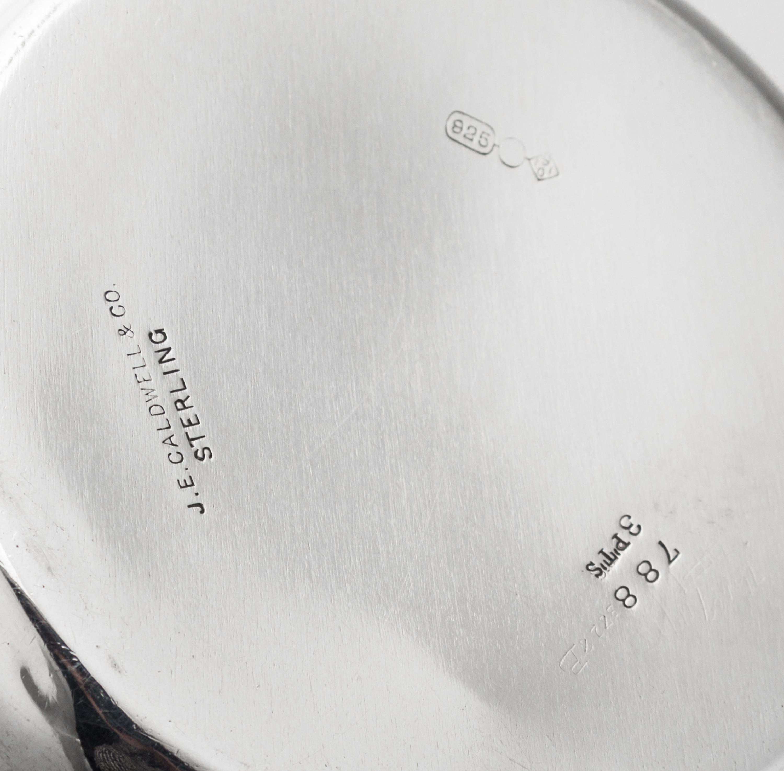 An American Silver Tyg, Dominick & Haff, New York, NY, 1901, Retailed by J.E. Caldwell, Philadelphia, PA, having foliate capped twin ha