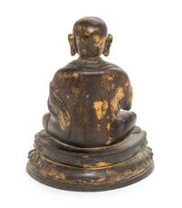 A Sino-Tibetan Parcel Gilt Bronze Figure of Guru Height 8 inches. — MING DYNASTY (1368-1644)
