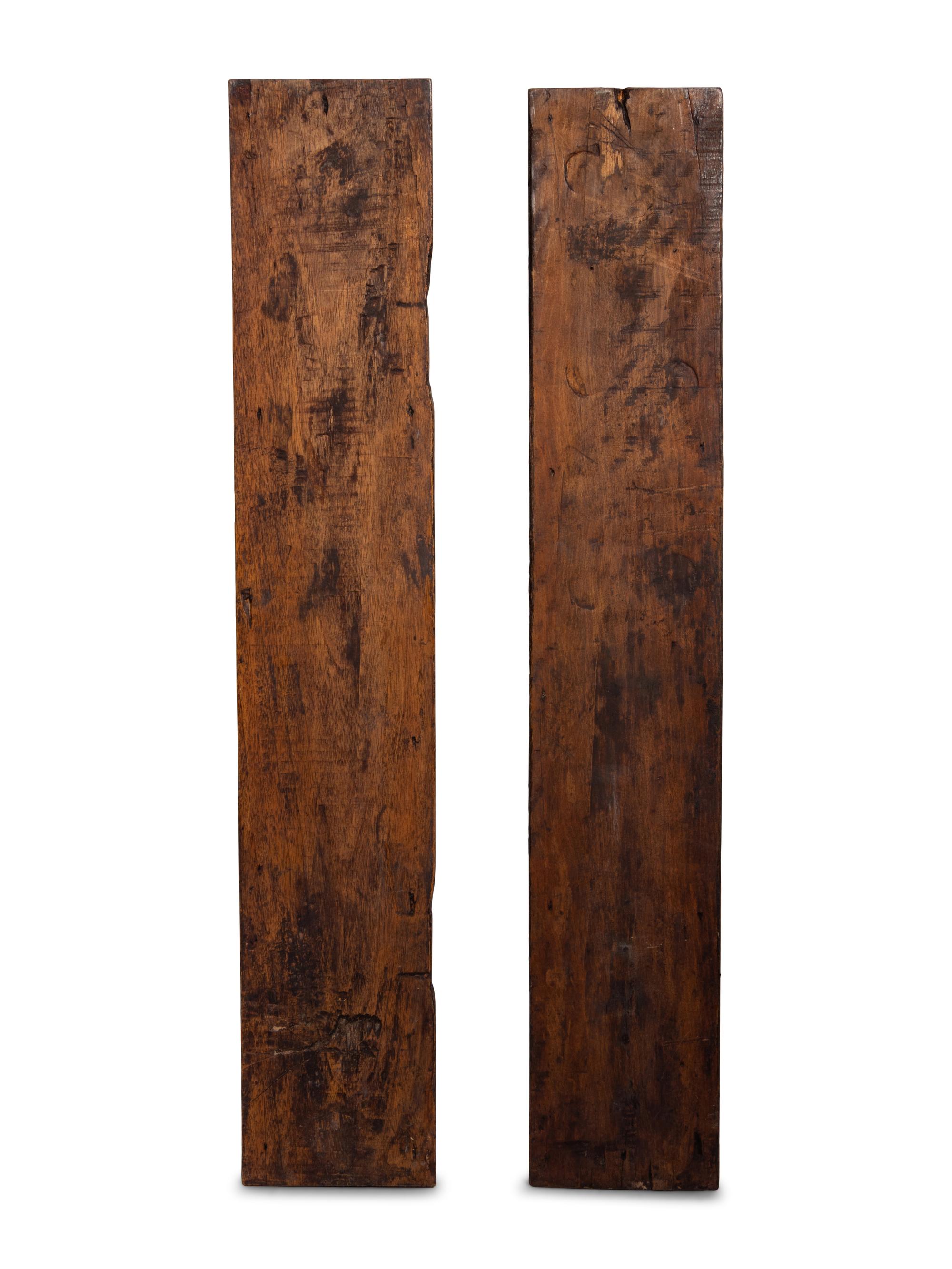 A Pair of Continental Carved Figural Pilasters