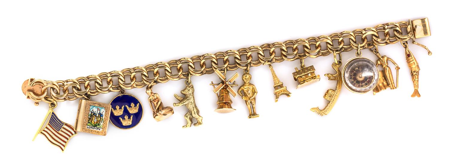 A 14 Karat Yellow Gold Charm Bracelet with 13 Attached Charms, 41.10 dwts.