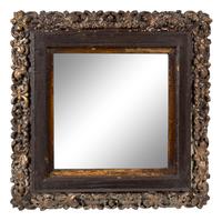 A Continental Polychrome and Parcel-Gilt Carved Mirror