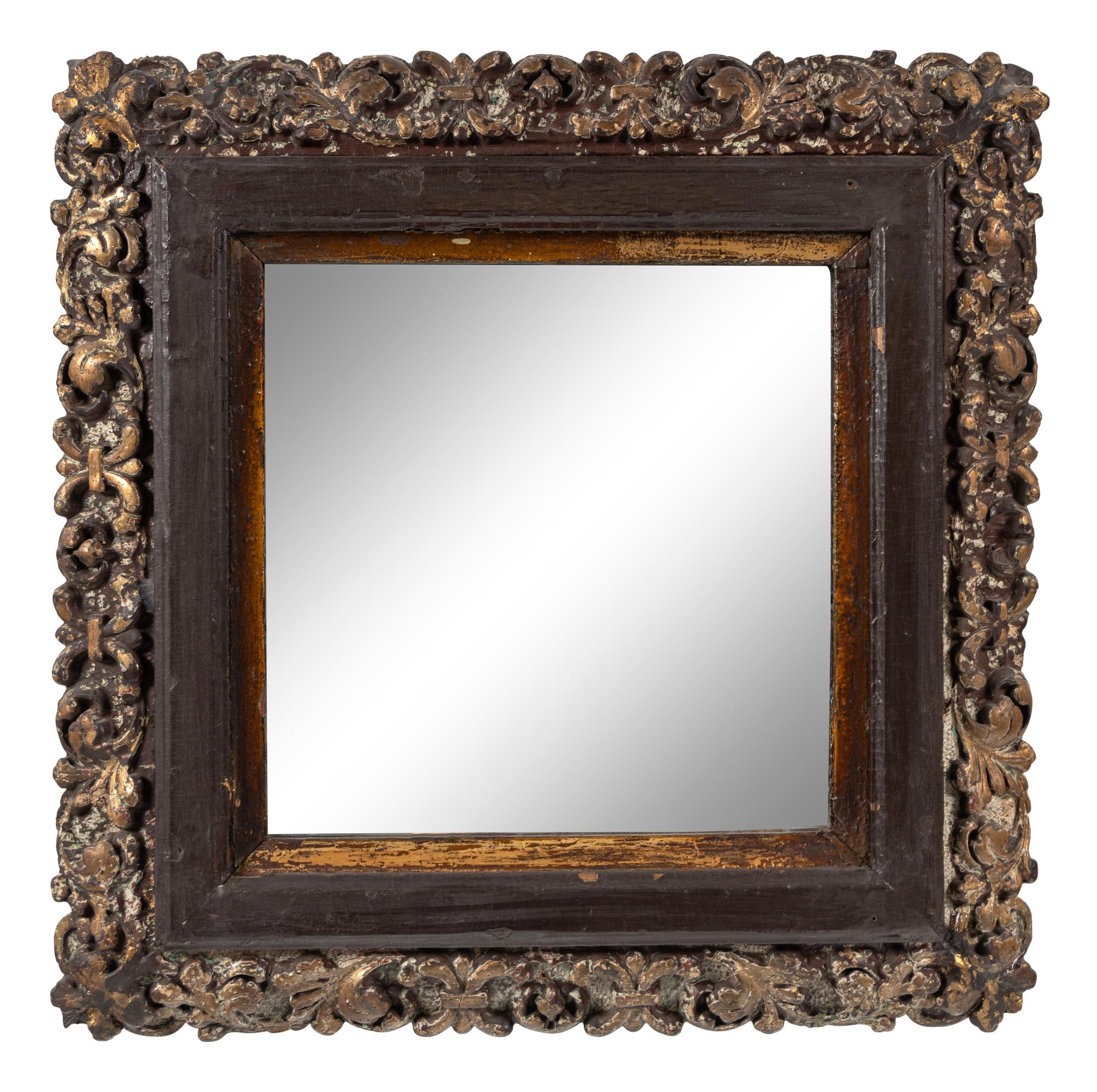 A Continental Polychrome and Parcel-Gilt Carved Mirror