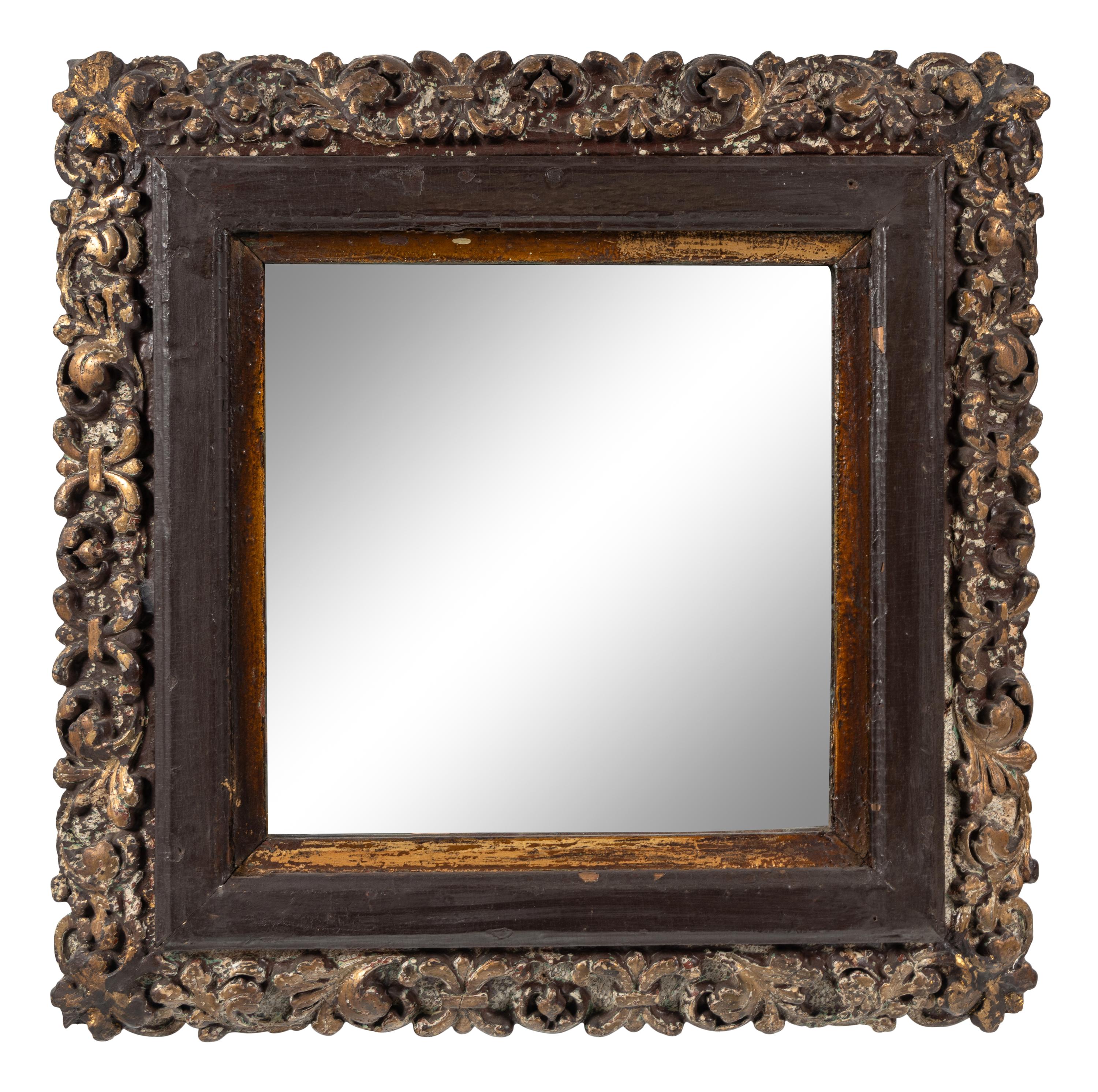 A Continental Polychrome and Parcel-Gilt Carved Mirror
