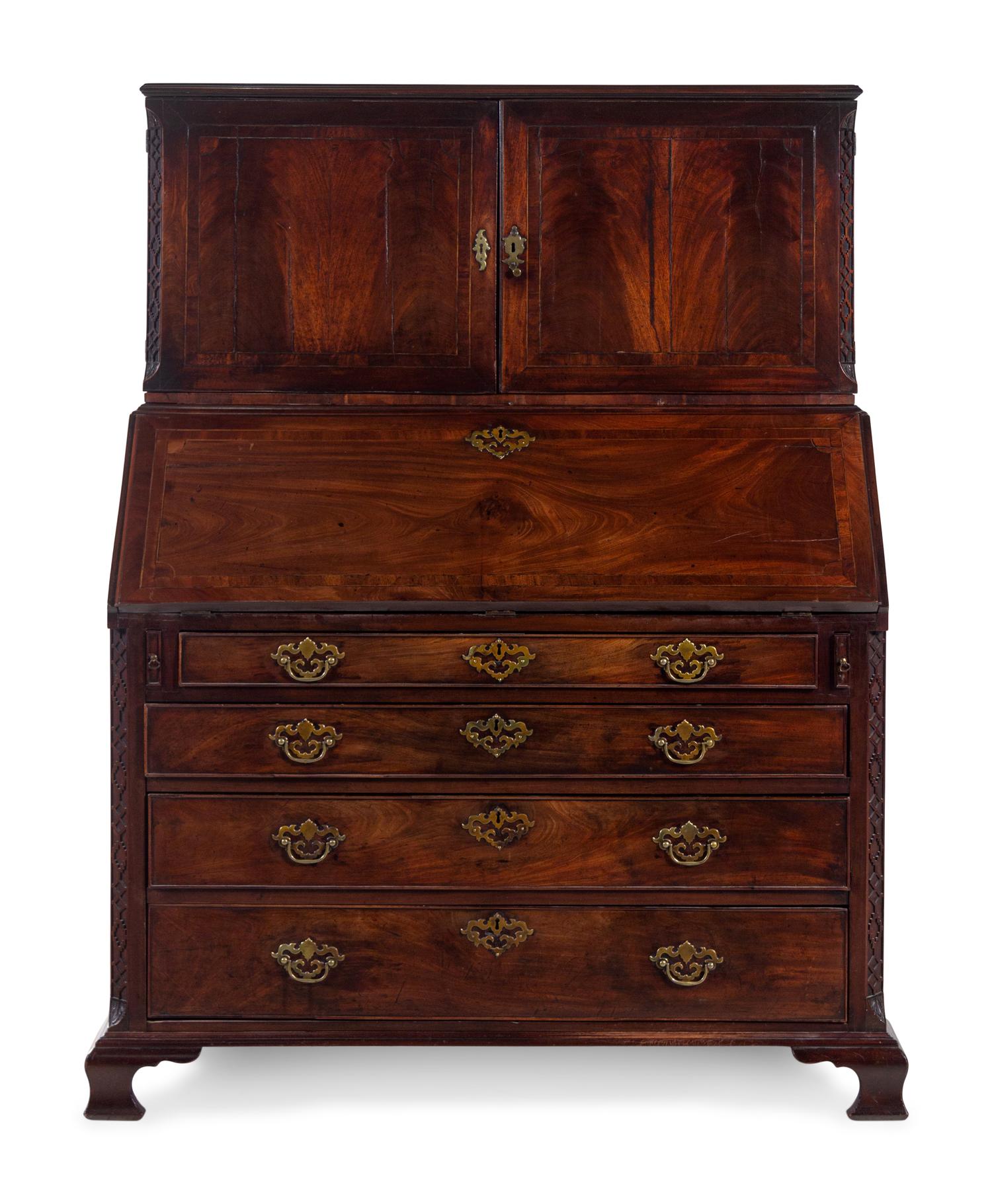 A George III Carved Mahogany Slant-Front Secretary Desk in the Chippendale Taste
