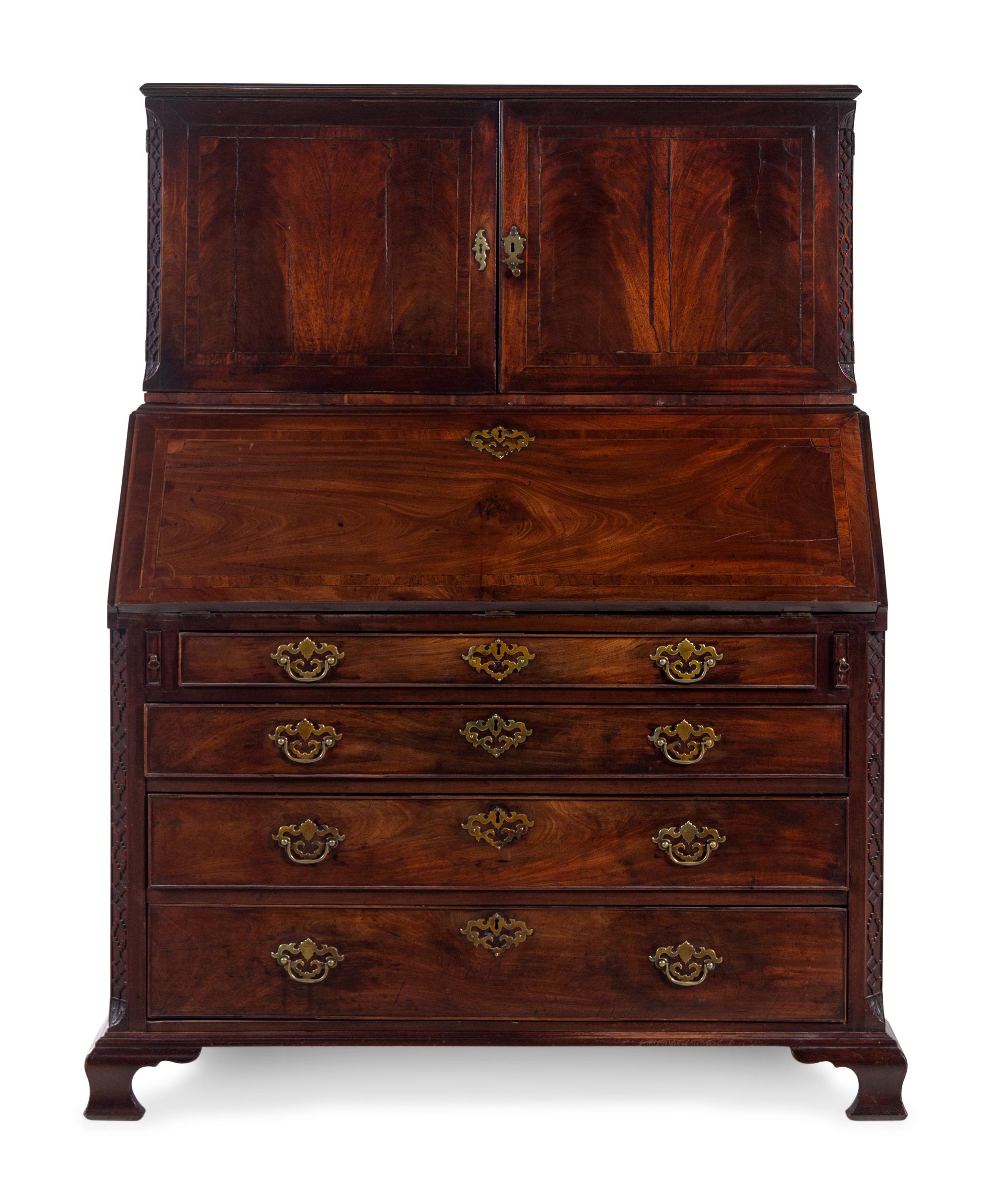 A George III Carved Mahogany Slant-Front Secretary Desk in the Chippendale Taste