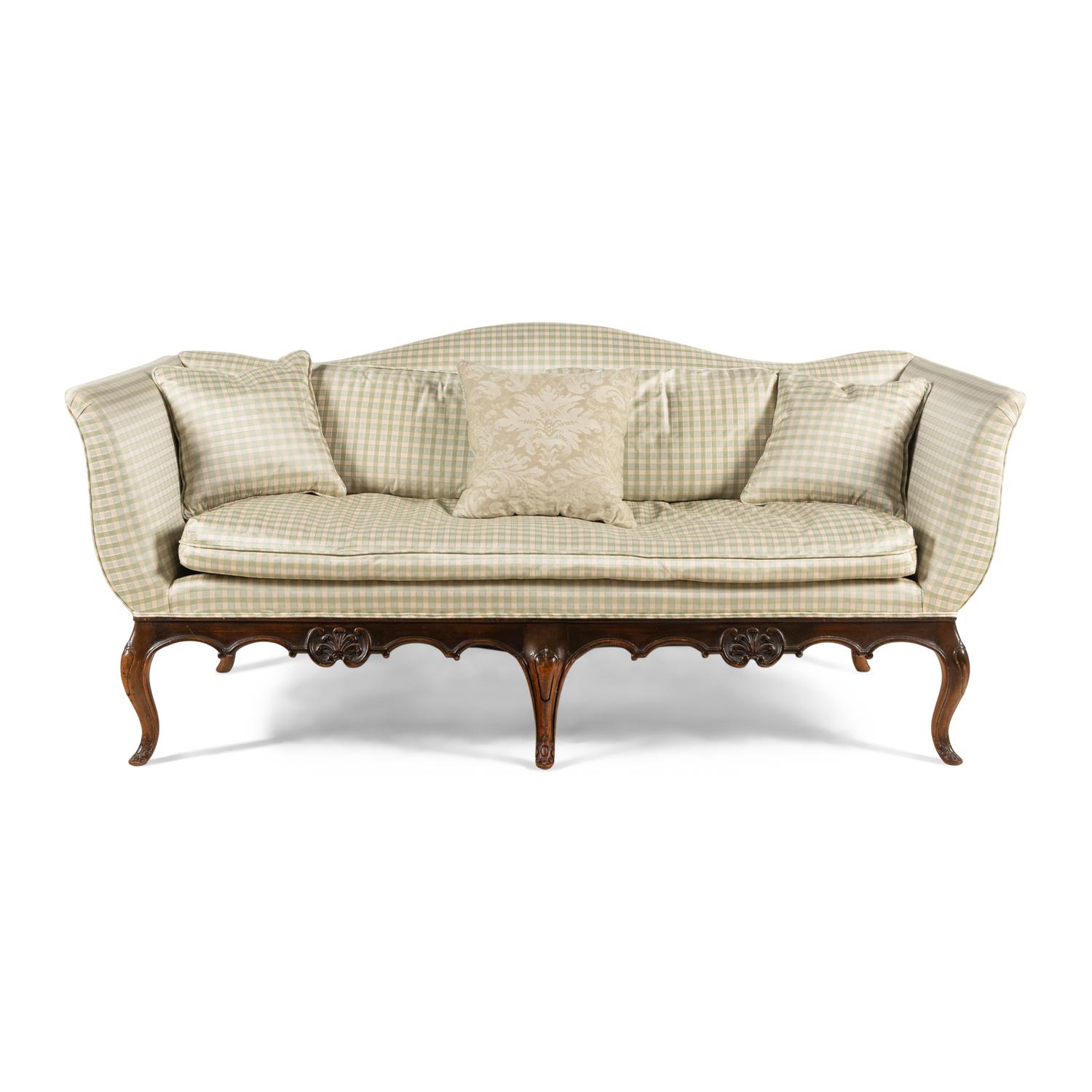 A Venetian Style Walnut Camelback Sofa