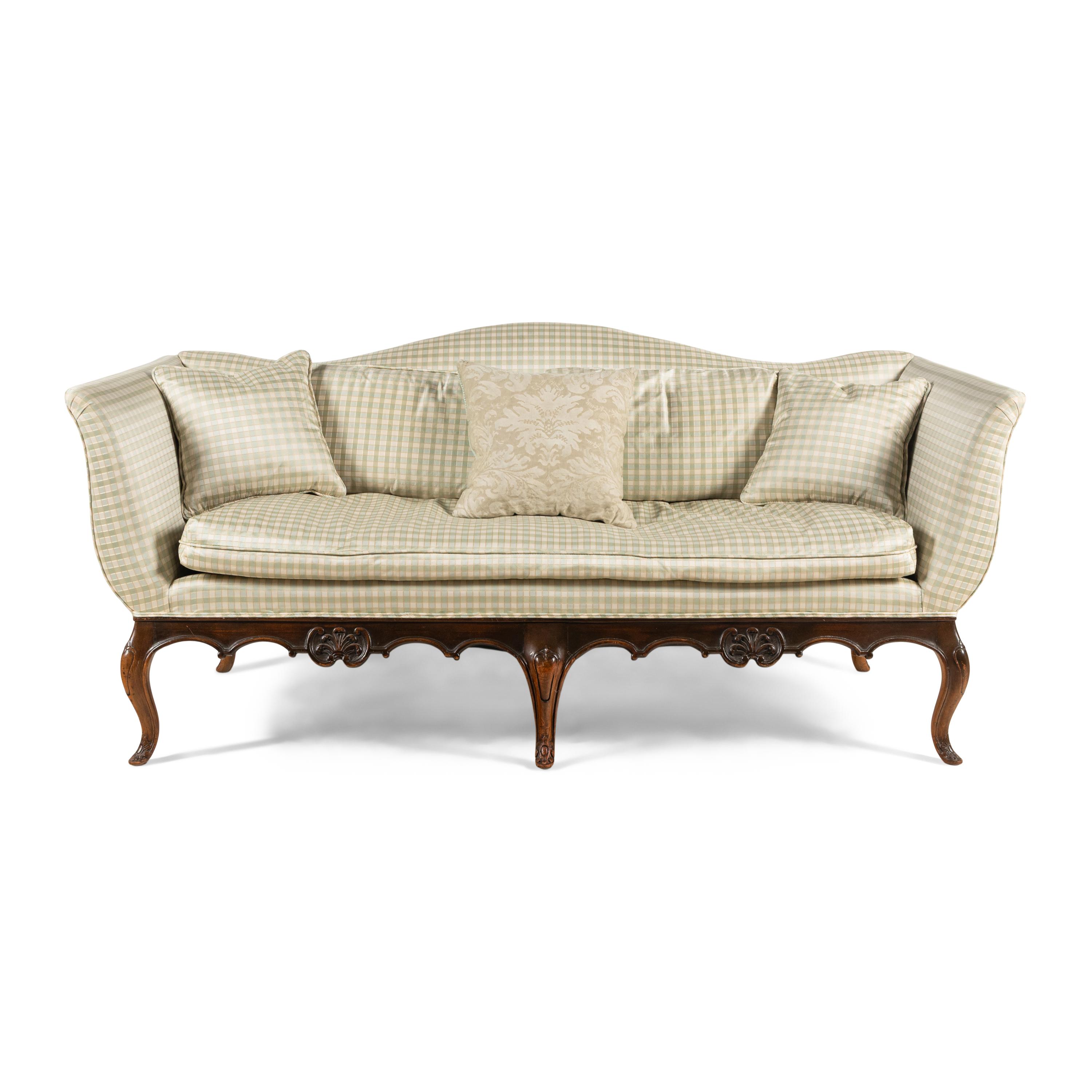 A Venetian Style Walnut Camelback Sofa