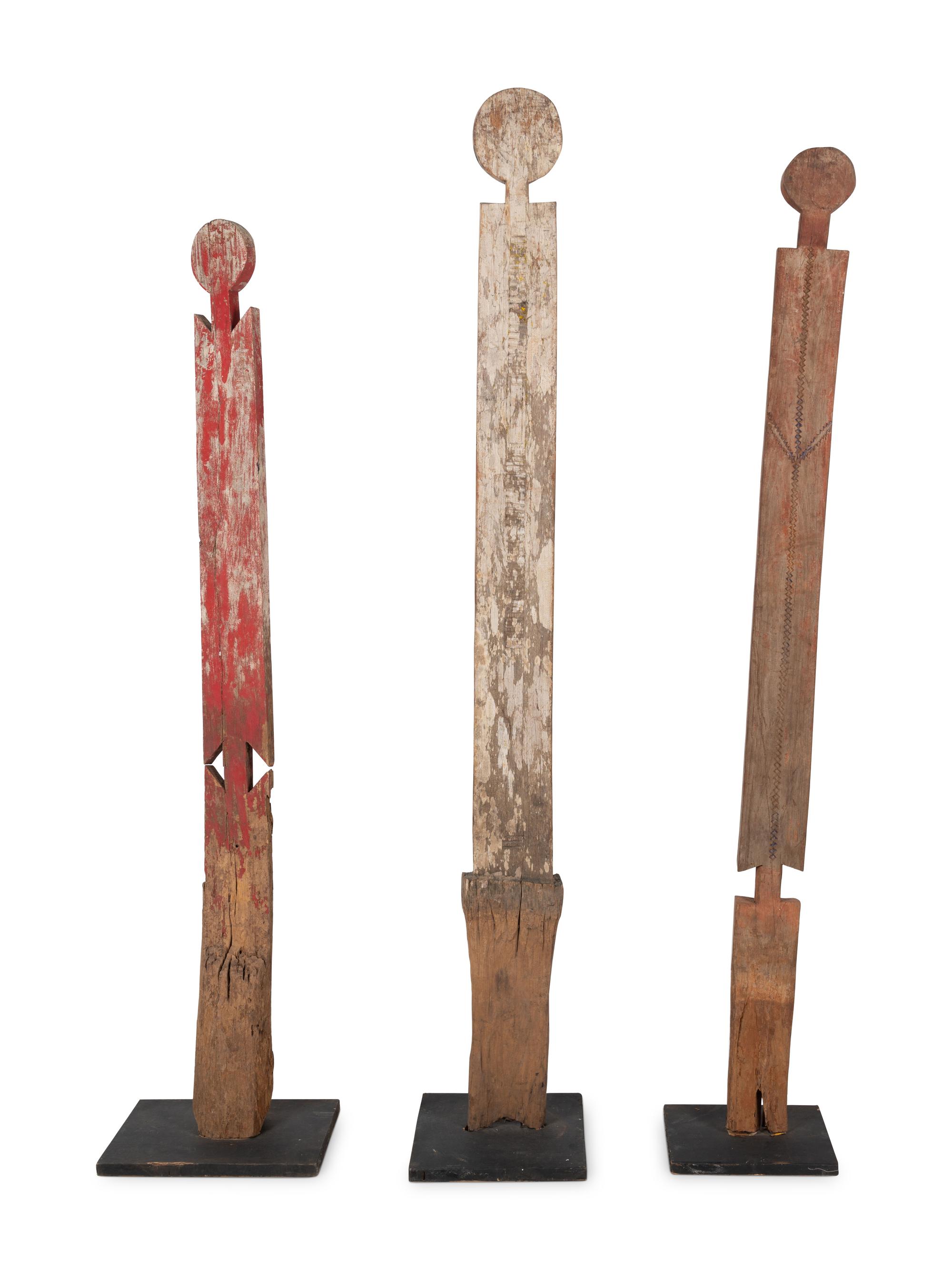 A Group of Three Carved Commemorative Posts