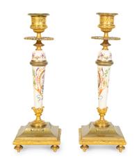 A Pair of French Gilt Bronze and Painted Porcelain Candlesticks