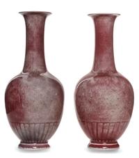 A Pair of Peach-Bloom Glazed Porcelain Bottle Vases Height 7 1/2 inches.