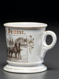 A Photographic Transfer Porcelain Shaving Mug Depicting a Man Driving a Horse and Buggy
