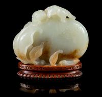 A Pale Celadon and Russet Jade Model of Pomegranates Height 3 inches. — 18TH/19TH CENTURY