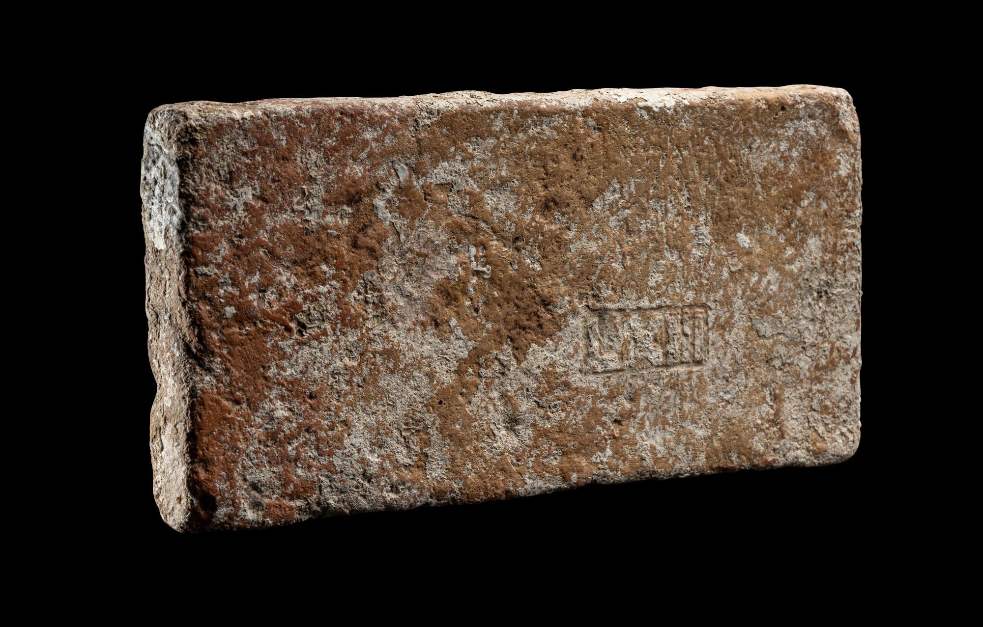 A Roman Ceramic Brick Stamped LXIII
