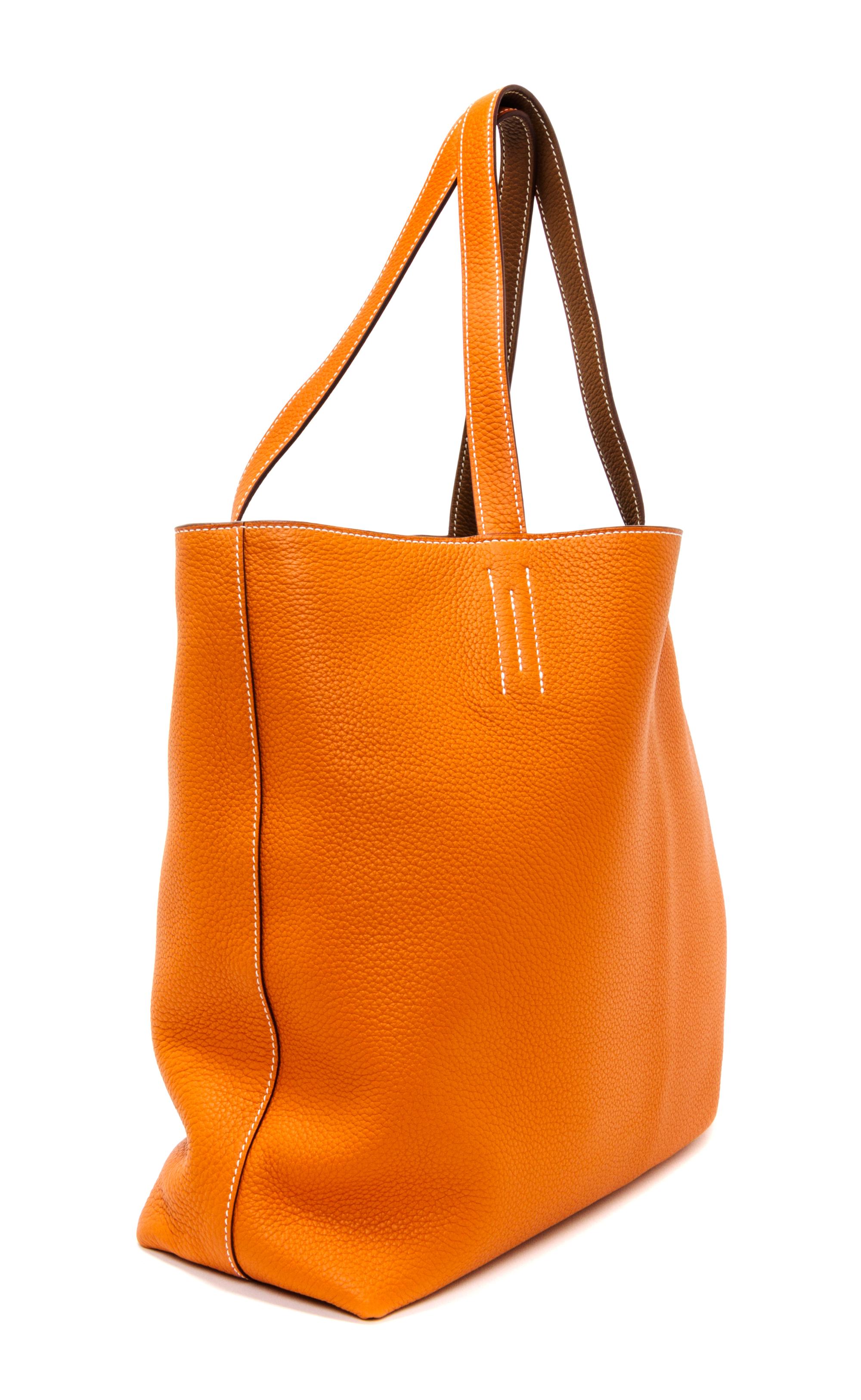 An Hermes Orange/Gold 45cm Taurillon Clemence Double Sens Tote, 17.5" x 15.5" x 5".
